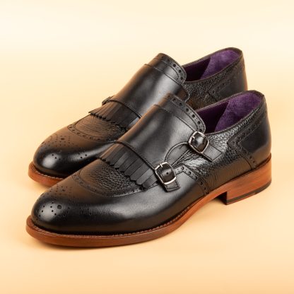 Men's black pair of monk shoes