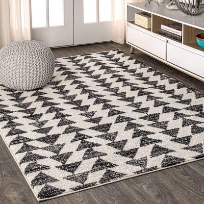 Geometric triangle pattern black and white carpet