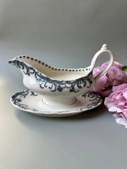 Ceramic sauce boat with blue and white strokes