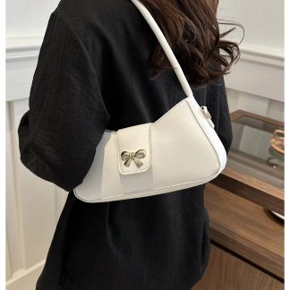 Cream leather underarm bag with bow embellishment