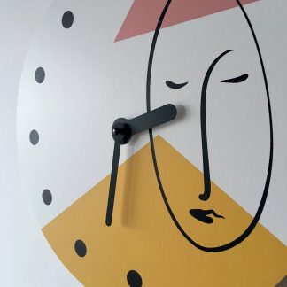 Artistic human face contrasting wooden wall clock
