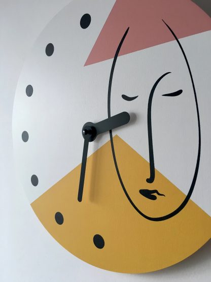 Artistic human face contrasting wooden wall clock