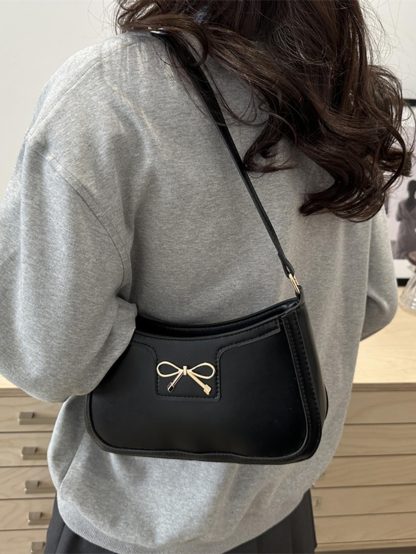 Bow-detailed leather underarm bag