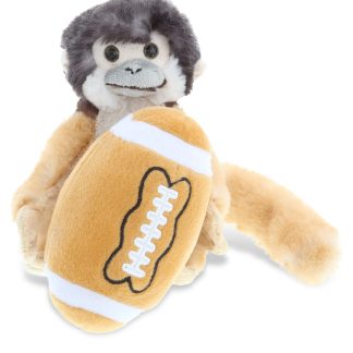 Cute monkey holding a football plush toy