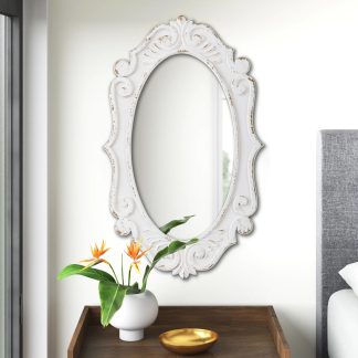 carved oval mirror