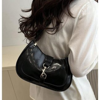 Avant-garde patent leather underarm bag
