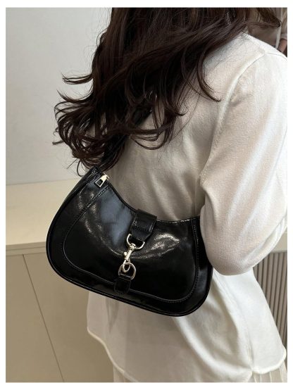 Avant-garde patent leather underarm bag
