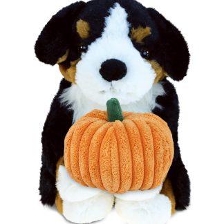 Cute puppy holding pumpkin plush toy