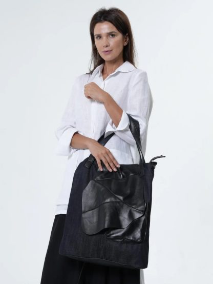 Trendy denim and leather tote bag
