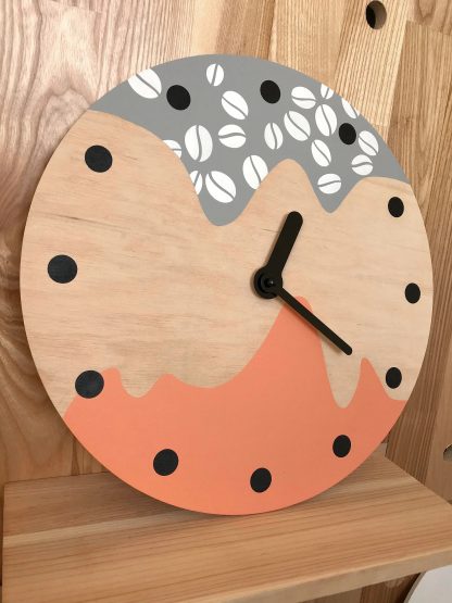 Coffee element contrasting wooden wall clock