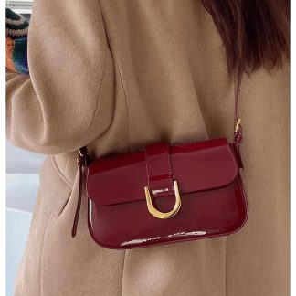 Burgundy patent leather buckled underarm bag