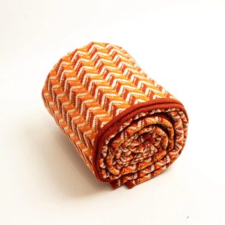 Orange and white zigzag wool-blend throw blanket