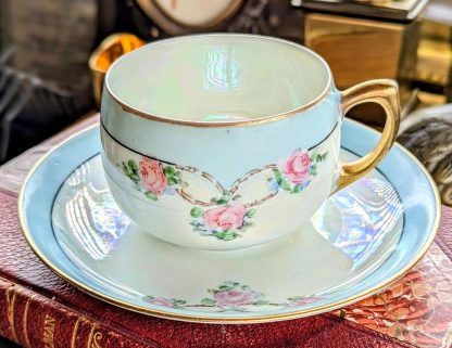 Glazed hand-painted rose cup and saucer set