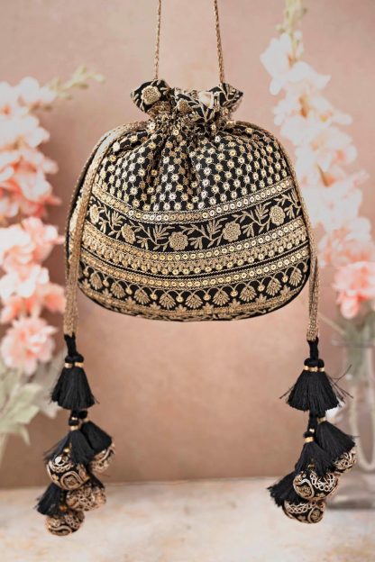 Black and gold embroidered tassel drawstring bag