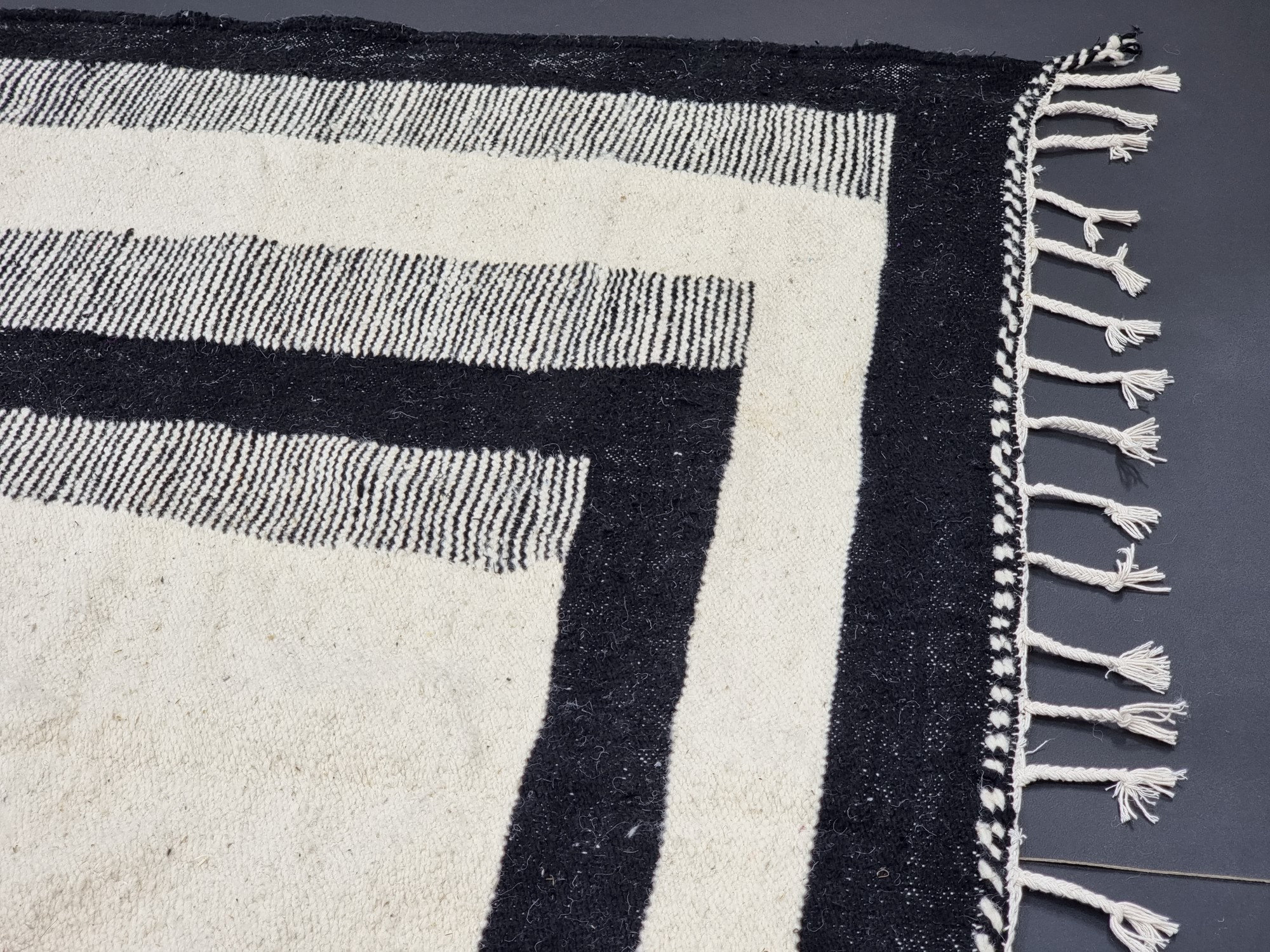 Handmade black and white geometric tassel rug - Image 6