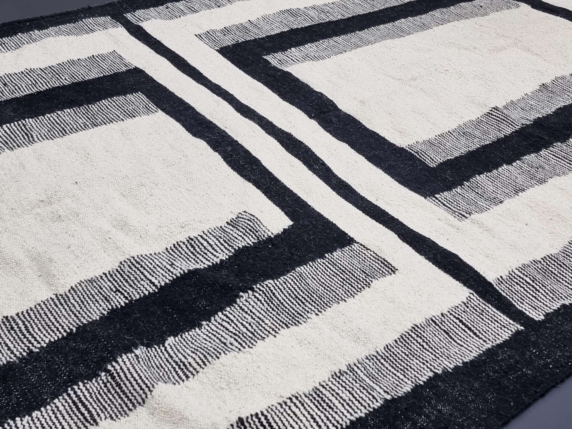 Handmade black and white geometric tassel rug - Image 5
