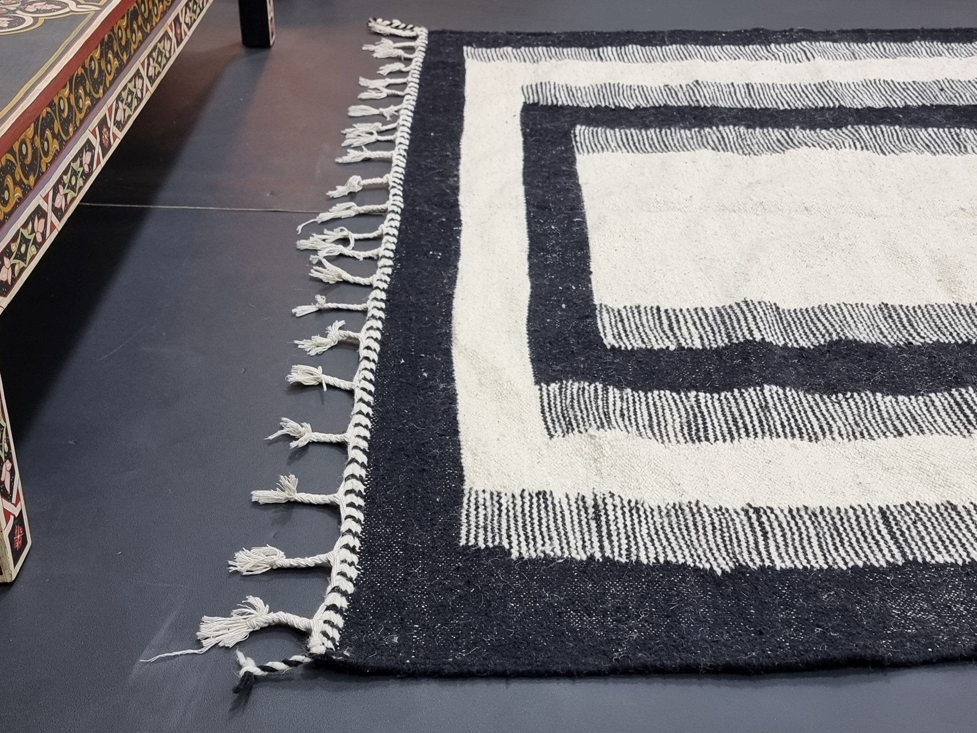 Handmade black and white geometric tassel rug - Image 4