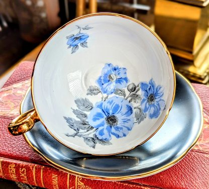 Black-glazed blue-flowered gilt cup and saucer set - Image 6
