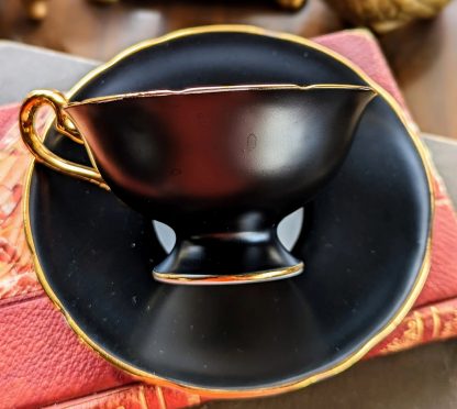 Black-glazed blue-flowered gilt cup and saucer set - Image 4