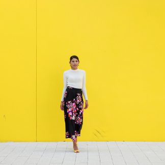 Black high-waisted maxi skirt with colorful floral print