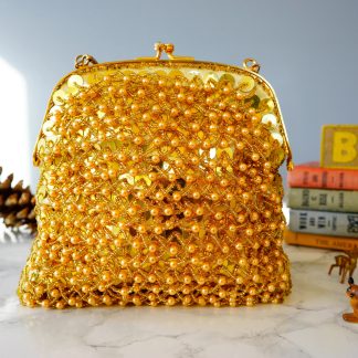 Luxurious gold hand-beaded lock bag