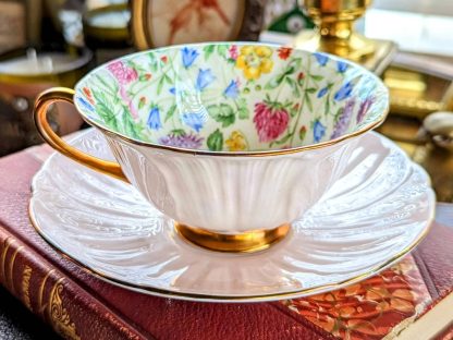 Embossed gilt bone china cup and saucer set