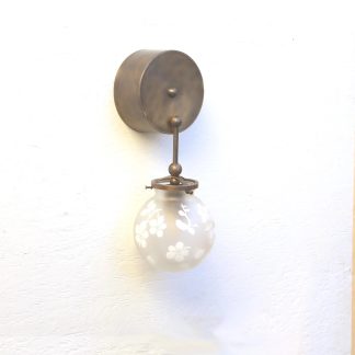 Brass hanging rod with frosted floral etched spherical wall lamp