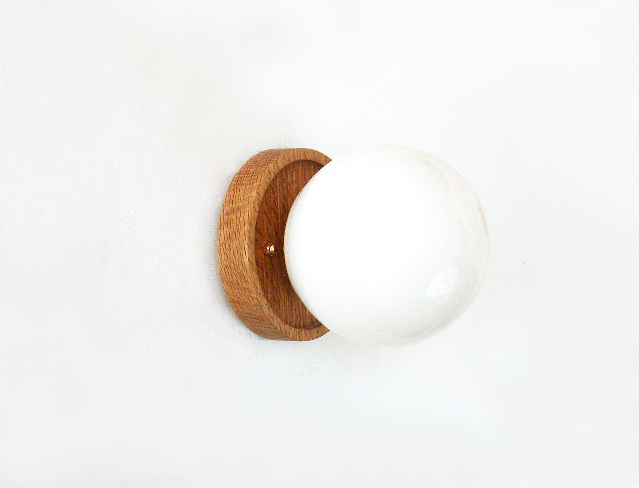 Wood and milky white spherical wall lamp
