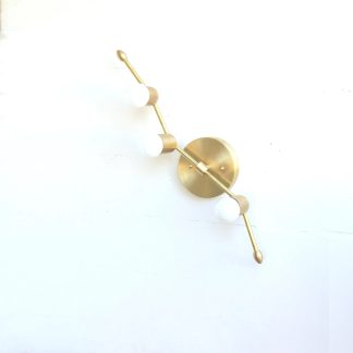 Brass angled rod and three opal spheres wall lamp
