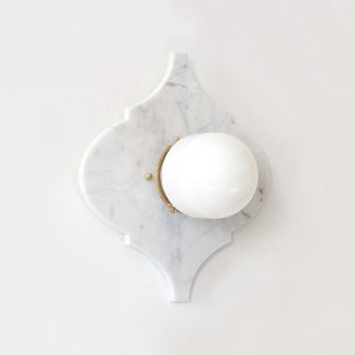Quatrefoil marble panel and opal sphere wall light