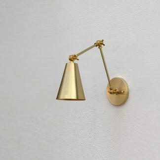 Brass articulated arm and tapered shade wall lamp