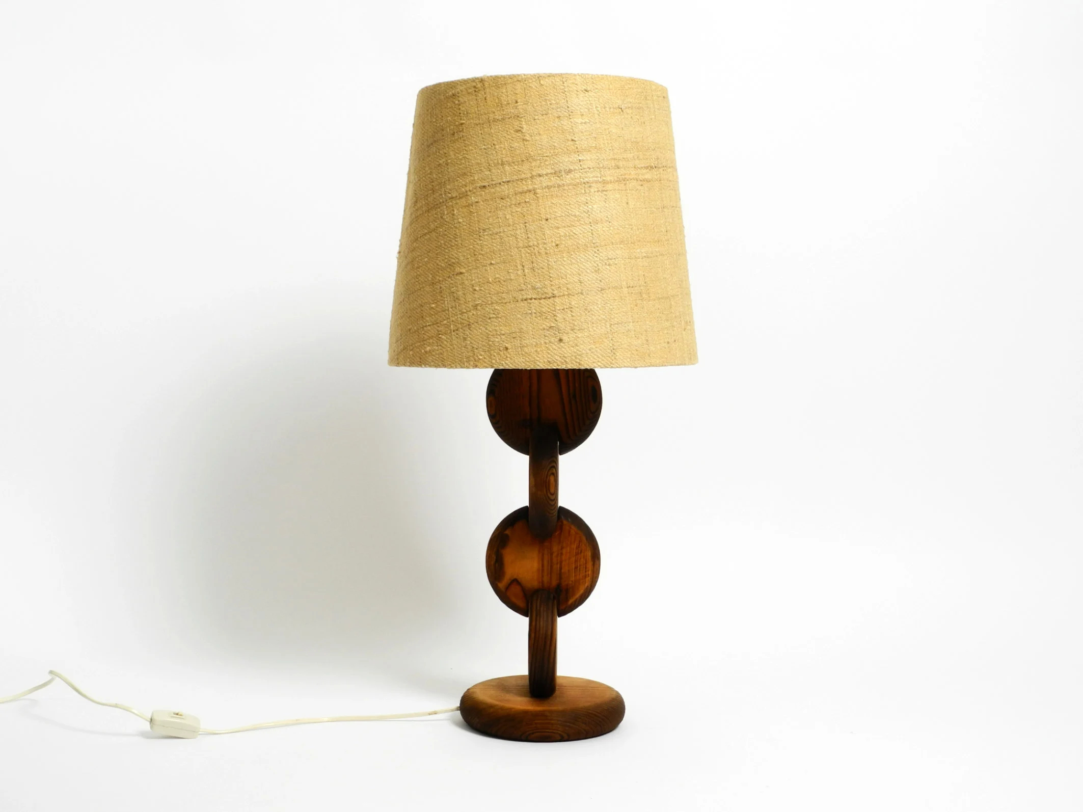 Carved wooden disc table lamp