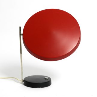 Red disc-shaped table lamp