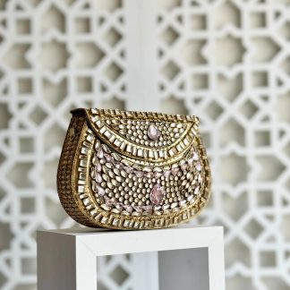 Gold-plated and pink gemstone-encrusted handbag