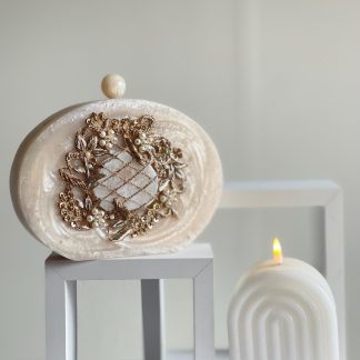 Ivory oval marble-patterned clutch