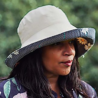 Cream-colored daisy-print sun hat with brim