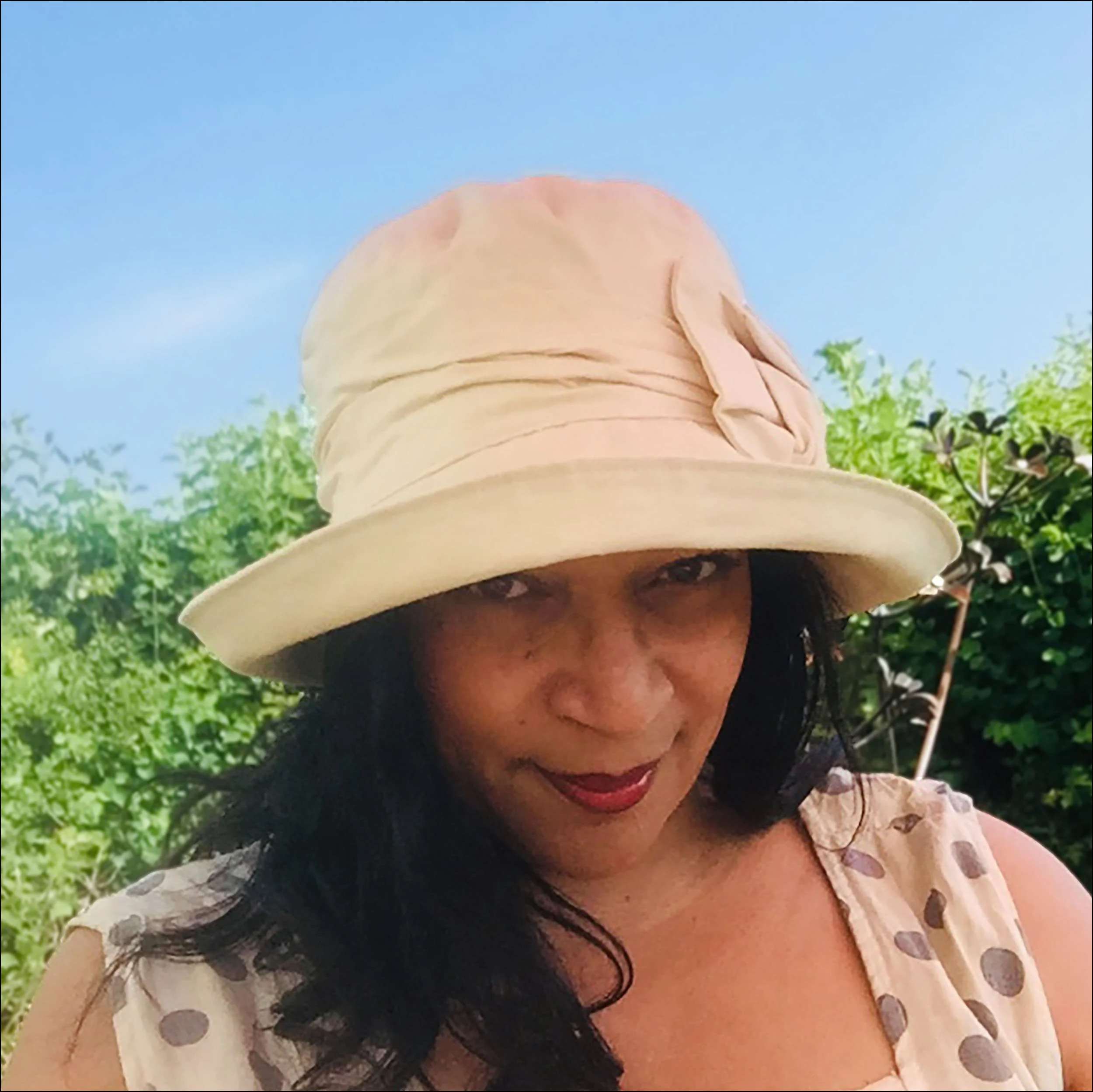 Elegant cream-colored floral ruffled sun hat
