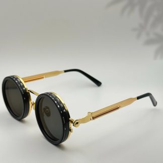 Mechanical-style round black and gold sunglasses