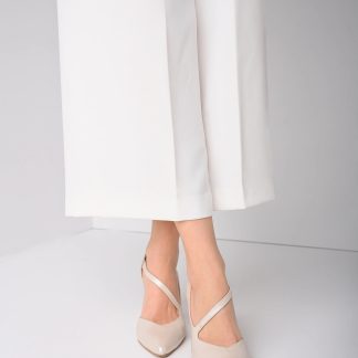 Porcelain white asymmetrical strappy chunky heels