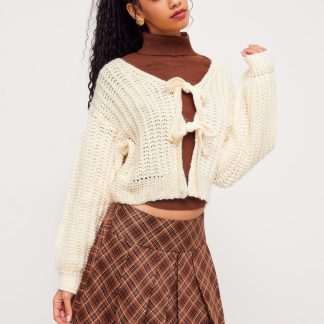 Cream-colored chunky knit belted cardigan