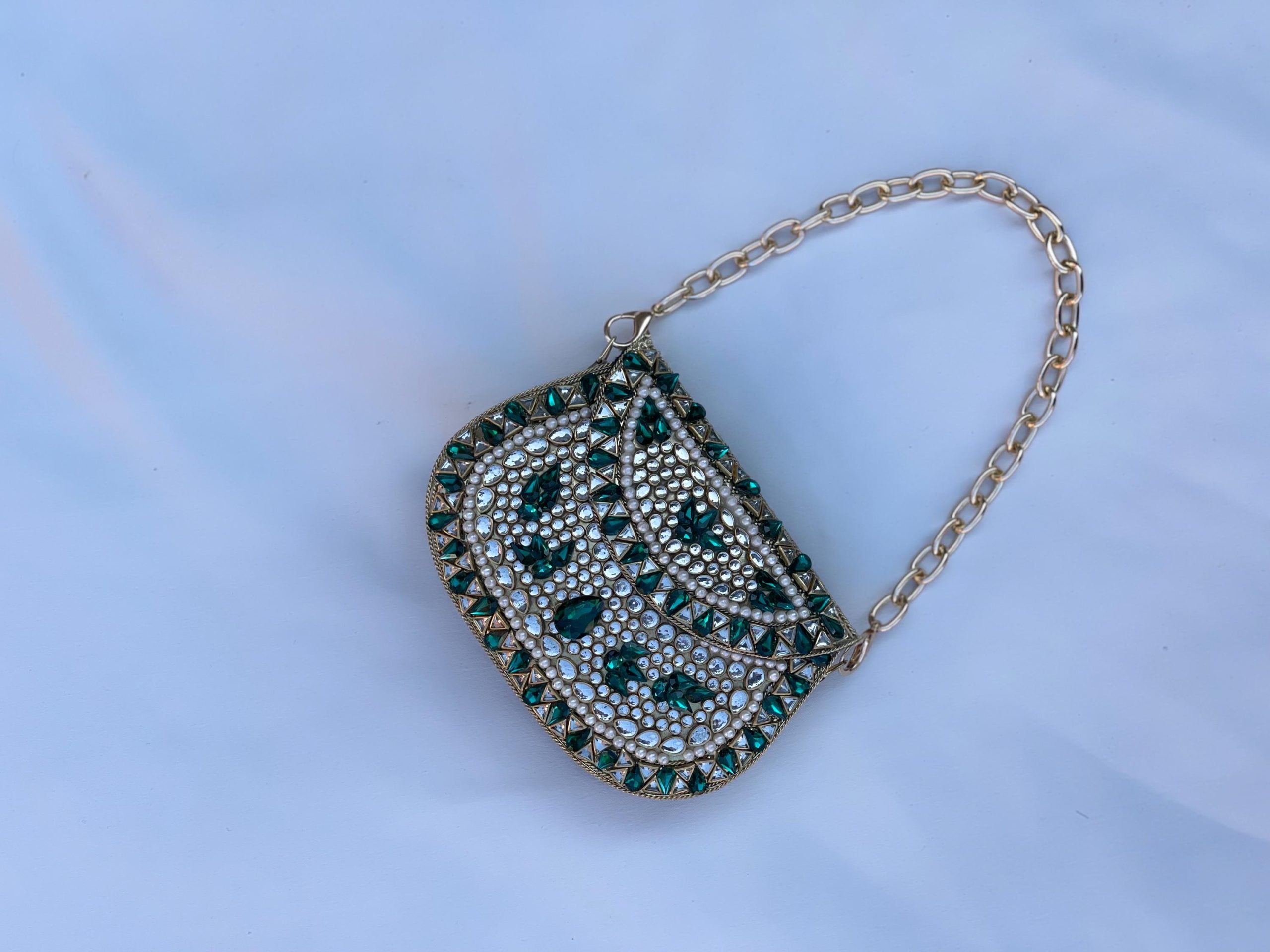 Emerald-encrusted mini clutch