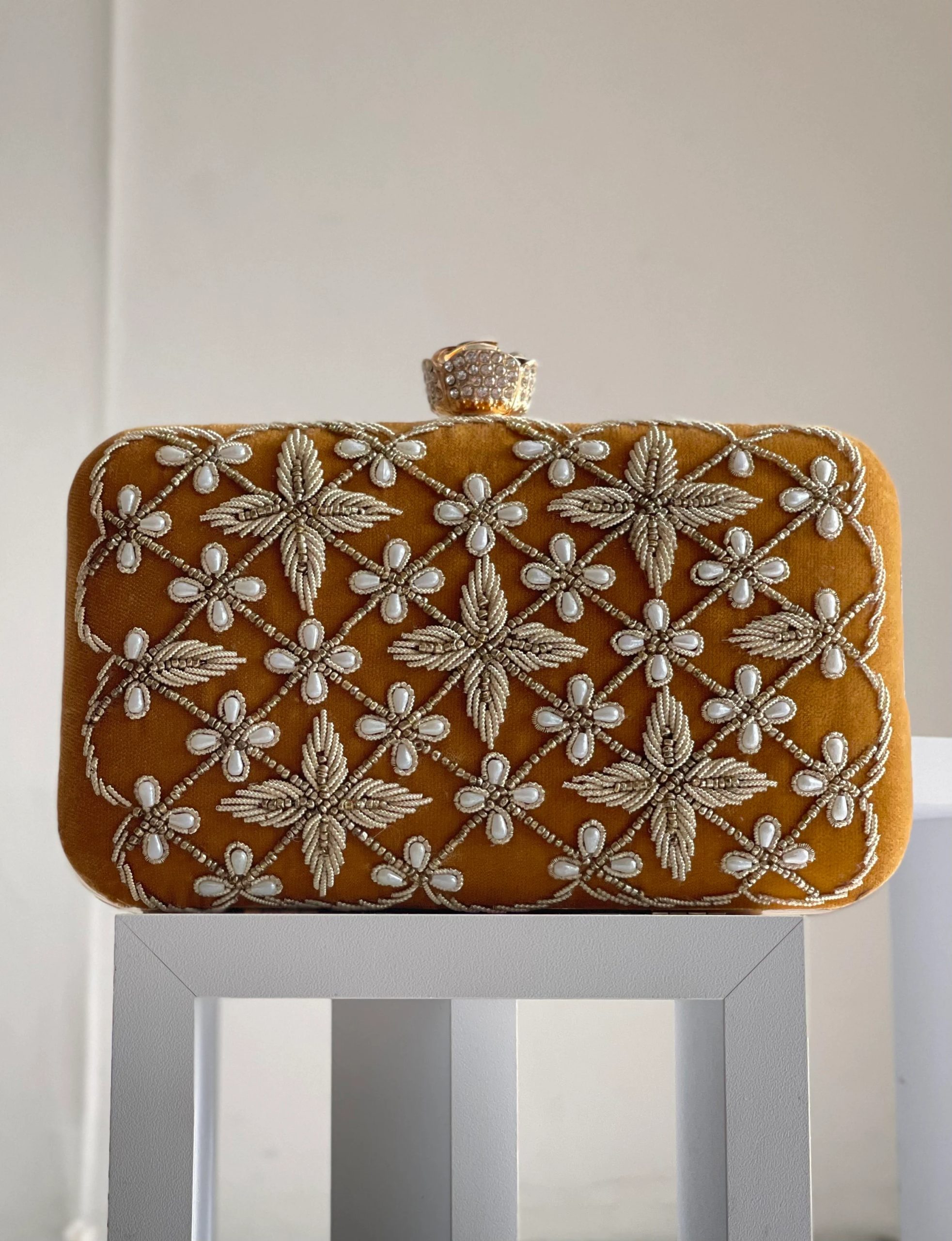 Embroidered mustard gold flower clutch