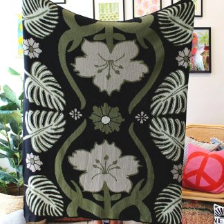 Black jacquard tassel blanket with botanical pattern